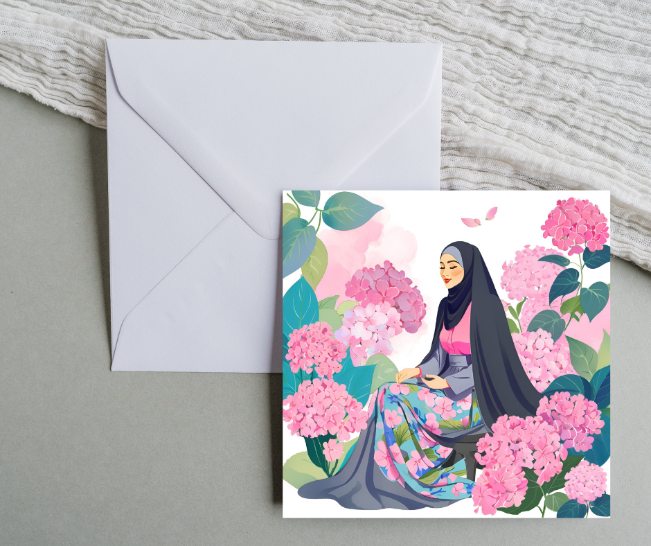 Hijabi woman blank square greeting card sitting amongst pink flowers
