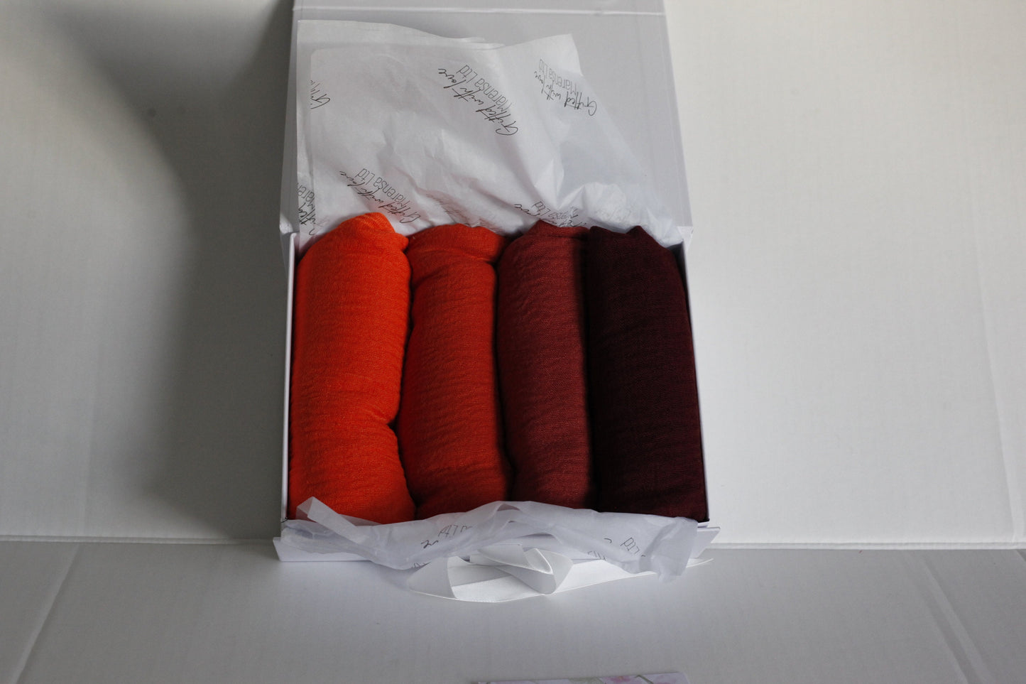 Shades of Orange and maroon crimple scarf with distressed edge, Perfect Eid Hijabs, or if you are gifting hijab gifts, perfectly boxed